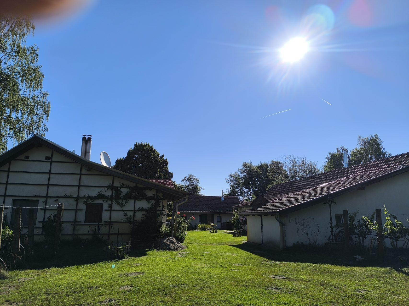 The farm buildings bathed in warm morning sunshine