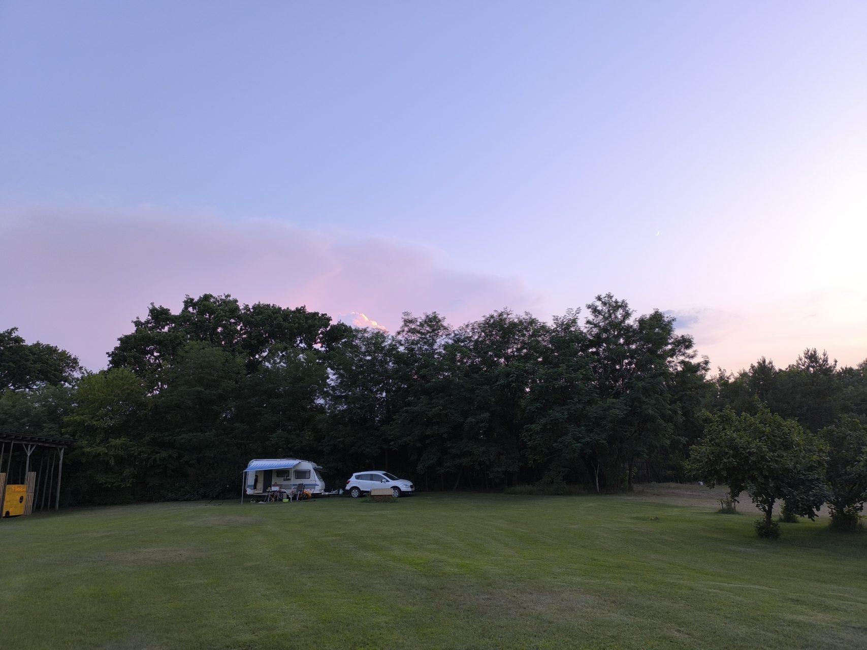 Space for campervans on the peaceful grounds at dusk
